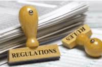 Rubber stamps marked "rules" and "regulations."