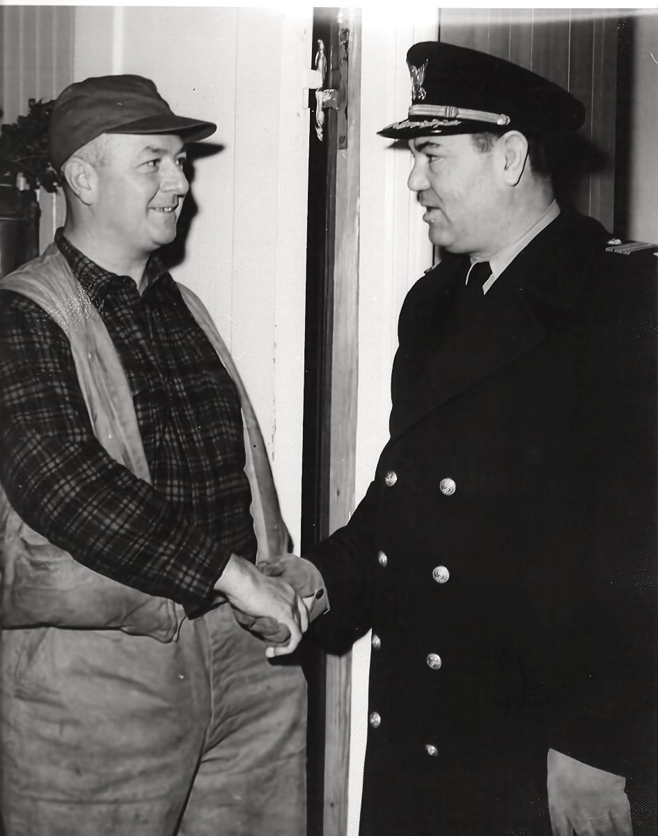 Ray Adams, left, shakes hands with Jack Dempsey, director of fitness during World War II for the Coast Guard. Photo courtesy of Currituck County Department of Travel and Tourism