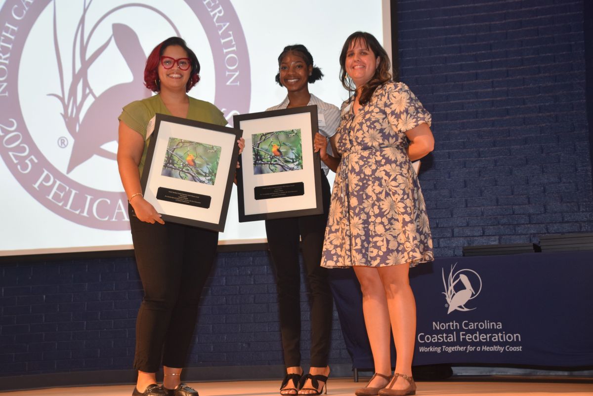 Lauren Johnson, left, and Tamarr Moore, center recently earned their master's degrees from N.C. Central University, and were recognized with a Pelican Award by Coastal Educator Rachel Bisesi, right. Photo: Mark Hibbs