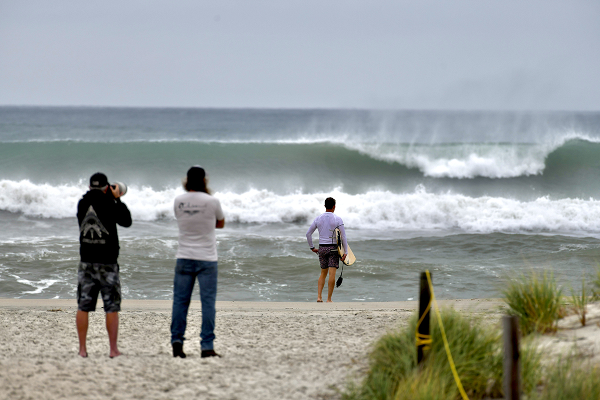 Storm swell associated with Hurricane Imelda breaks along the Bogue Banks shore at Oceanana Fishing Pier in Atlantic Beach. The storm, while moving away from the U.S. Tuesday, still packed a potent punch, forecasters said, and could bring possible minor flooding in areas of onshore winds along the Southeast coast. At 11 a.m. Tuesday, the storm was moving to the northeast, toward near Bermuda, but swells and high surf from Imelda and Hurricane Humberto were expected to produce dangerous marine conditions and rip currents along much of the East Coast for several days. Photo: Dylan Ray