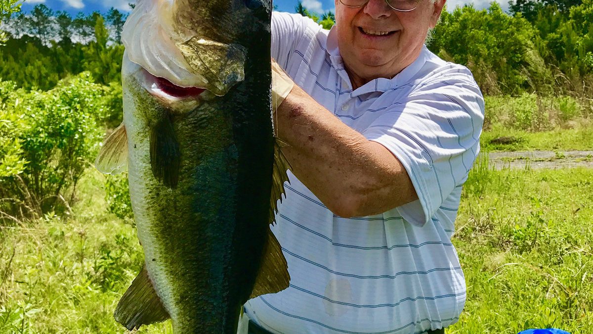 My father, Don Churchill proudly shows of this huge bass he caught when he was 79. Photo: From the author's collection