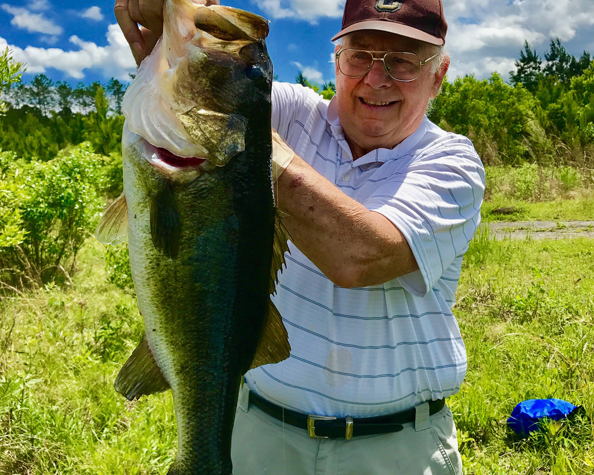 My father, Don Churchill proudly shows of this huge bass he caught when he was 79. Photo: From the author's collection