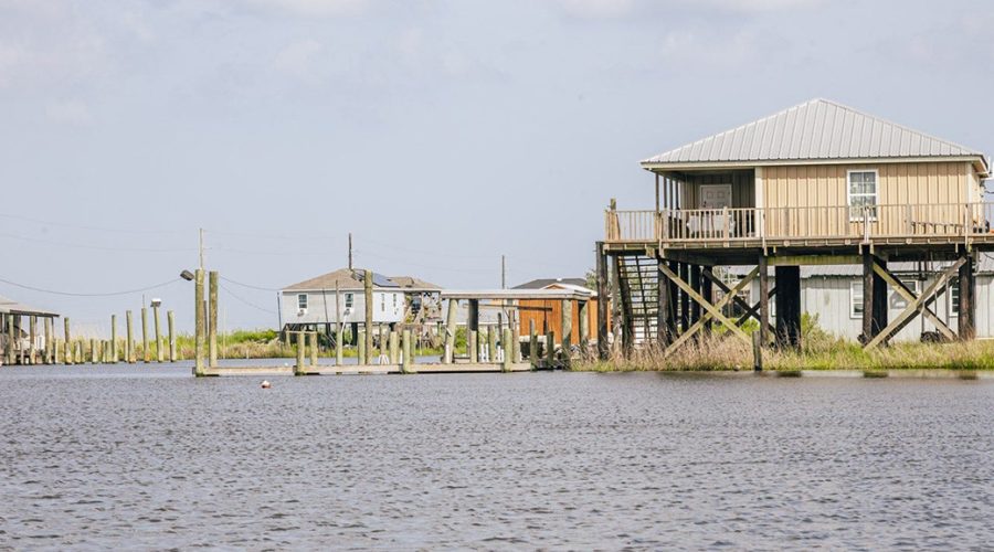 The remaining houses in Grand Bayou Village dot the marsh. No roads connect them. Photo: Baxter Miller