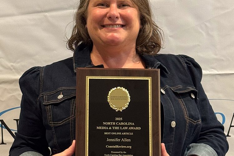 Jennifer Allen poses with her Media and the Law Award of Excellence from the North Carolina Bar Association Thursday in Cary. Photo: Vicki Hibbs