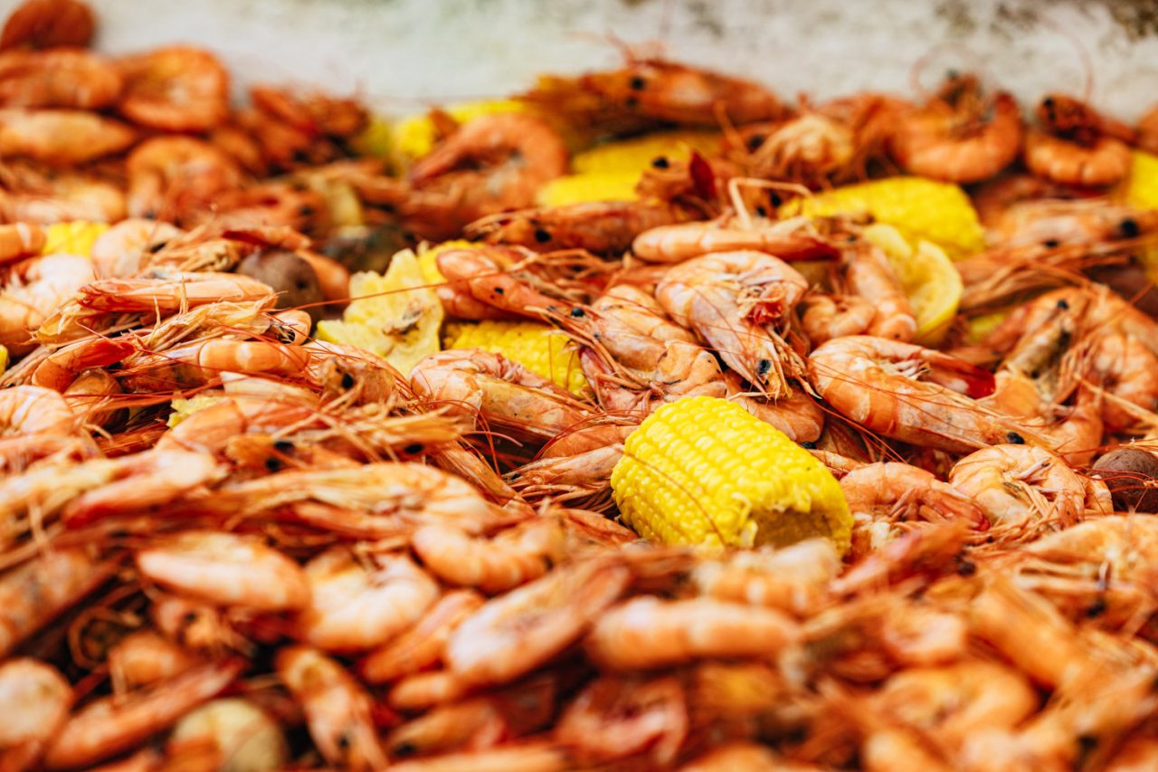 Lunch: Fresh steamed shrimp served on a hatch cover. Photo: Baxter Miller