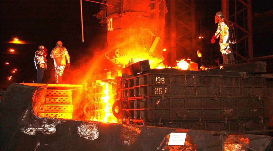 Workers in an unnamed steel mill are shown in this public domain photo by Jean Beaufort.