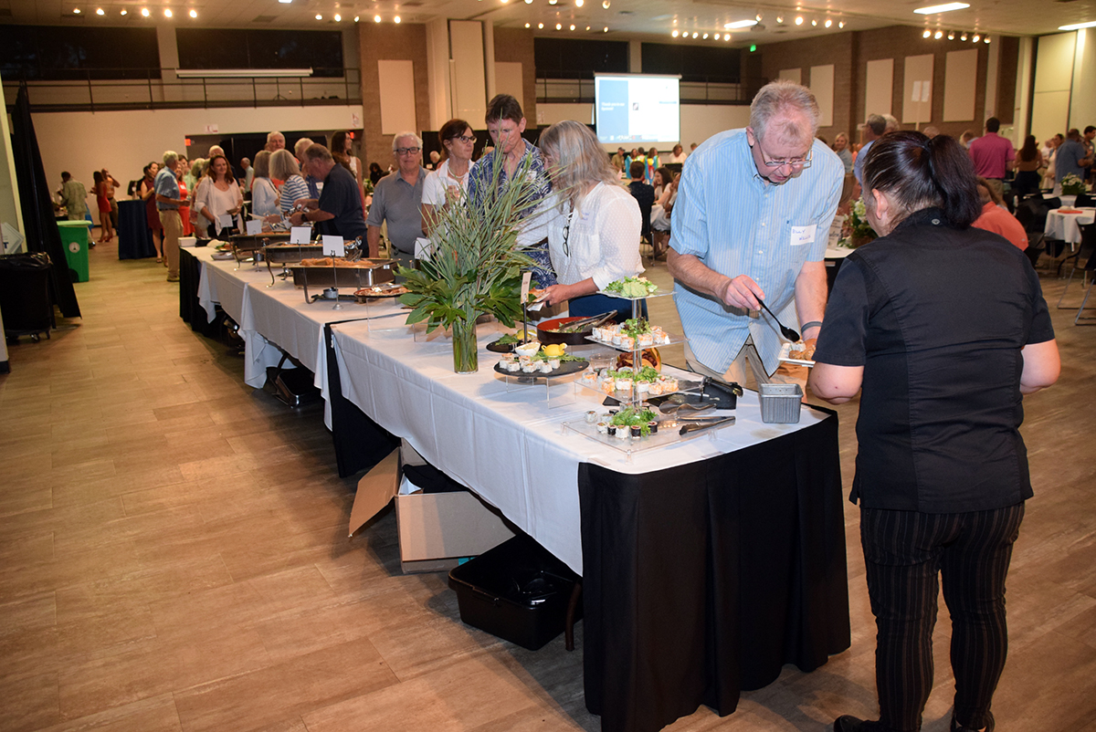 Taste of the Coast attendees line up for the buffet Saturday at the Crystal Coast Civic Center in Morehead City. Photo: Mark Hibbs