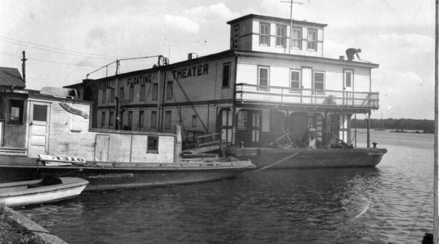 The James Adams Floating Theatre on the Pamlico River in Washington, N.C., 1940. The Floating Theatre’s troupe of actors and actresses toured coastal waterways from Florida to New Jersey from 1914 to 1941. Tugboats towed the Theatre from town to town, and the boat’s troupe usually did a week-long run before heading to their next stop. Photo courtesy, State Archives of North Carolina