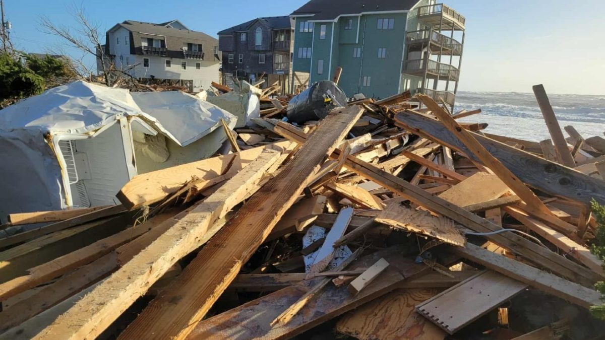 Debris from homes that collapsed this week line the Buxton oceanfront on Hatteras Island early Thursday. Photo: Joy Crist/Island Free Press