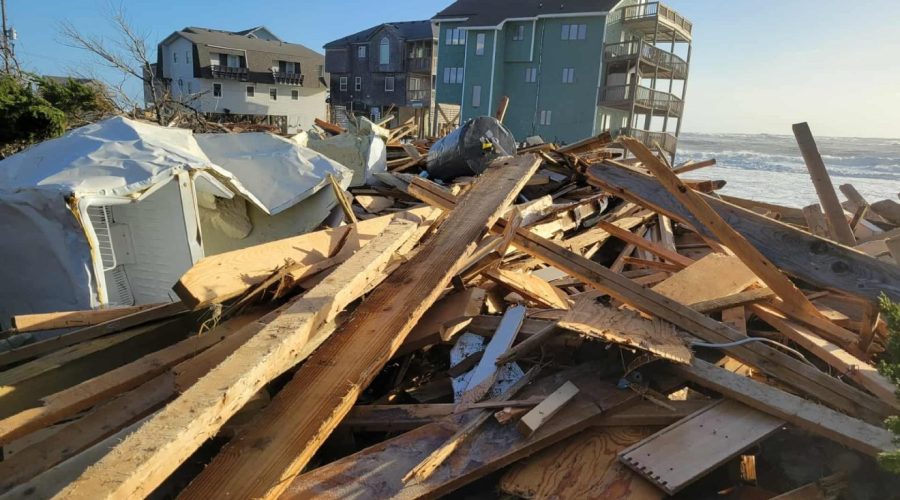 Debris from homes that collapsed this week line the Buxton oceanfront on Hatteras Island early Thursday. Photo: Joy Crist/Island Free Press