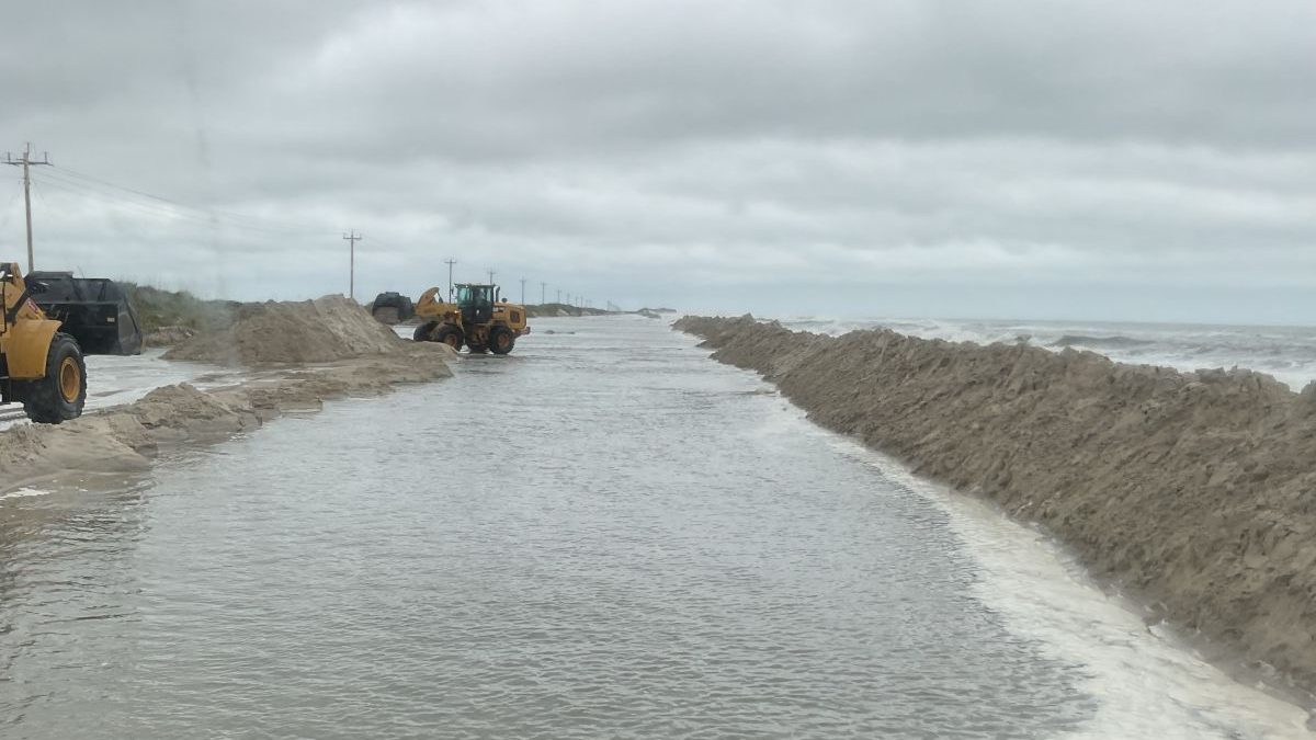 North Carolina Department of Transportation crews working to rebuild the dune next to N.C. 12 on the north end of Ocracoke Island. Photo: NCDOT