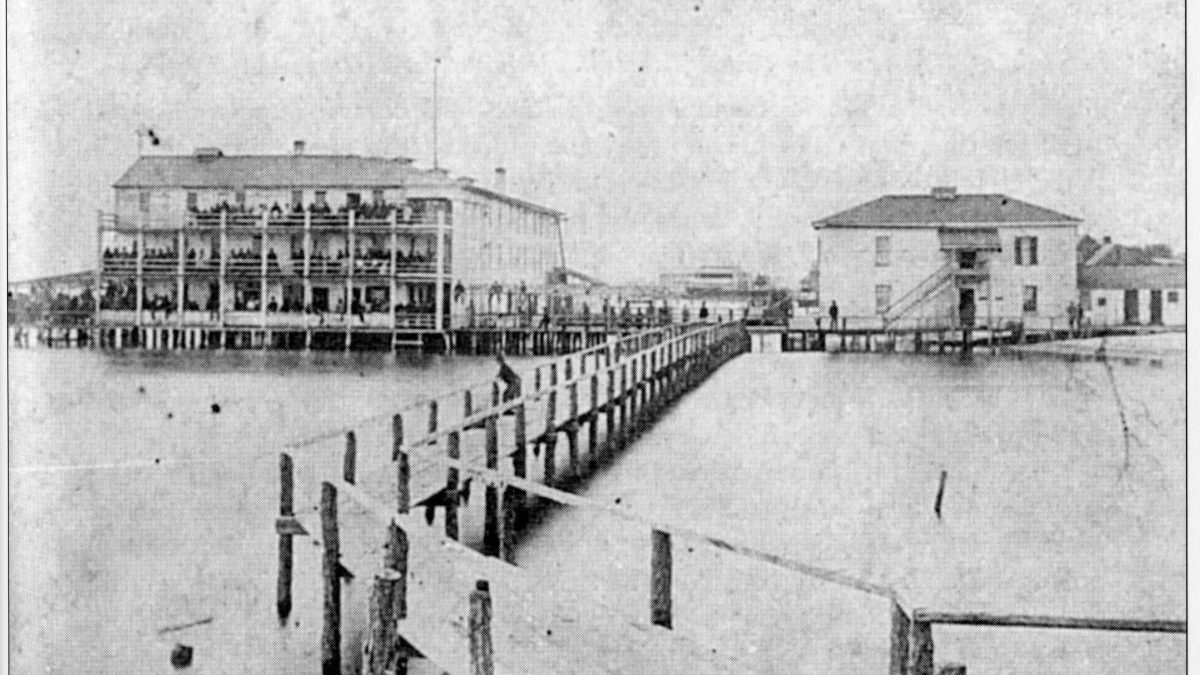 An early view of the Newspaper clipping of Atlantic Hotel in Beaufort before it was destroyed in an 1879 hurricane courtesy of NC Maritime Museums.