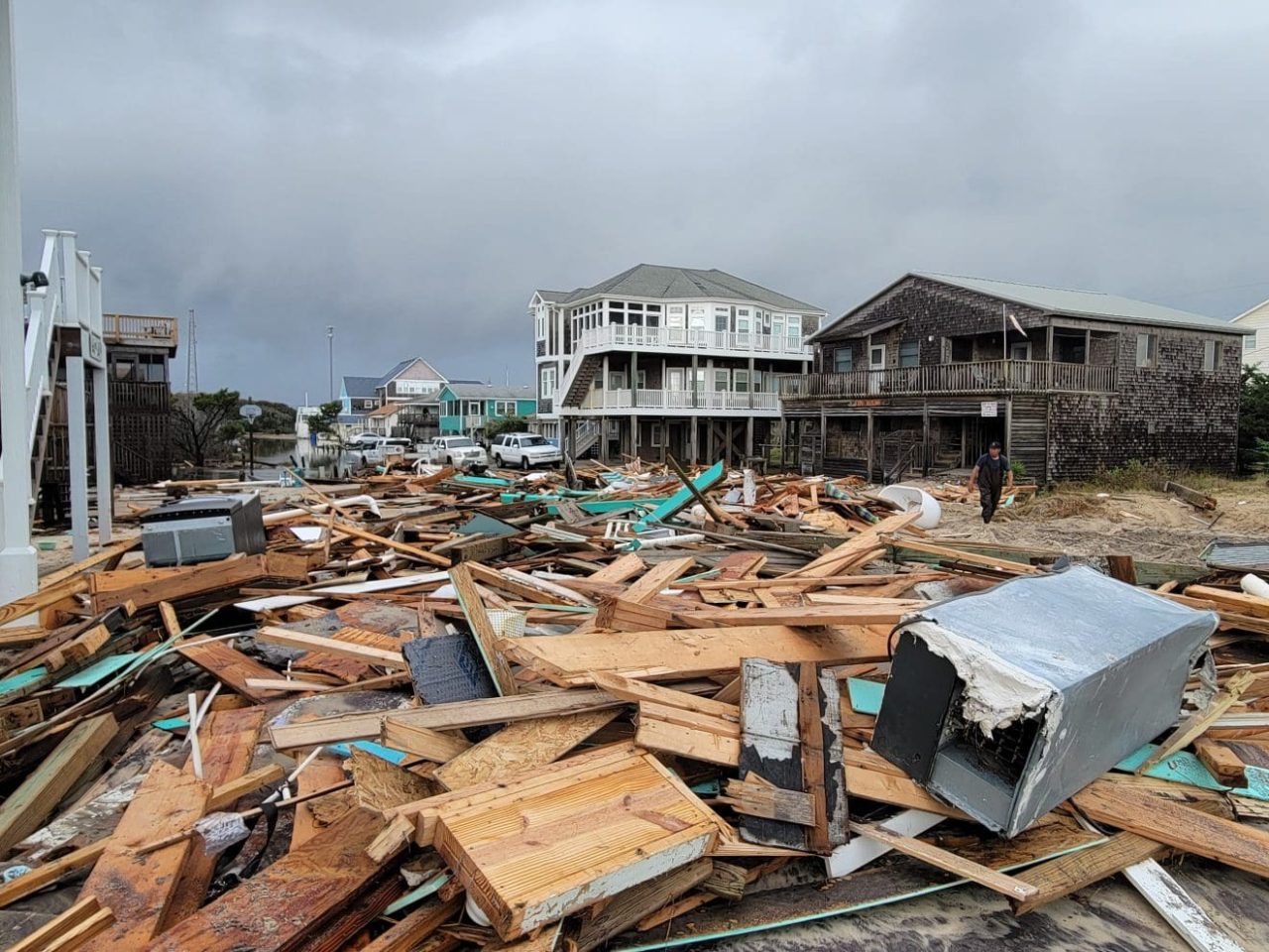 Debris from five oceanfront homes that fell into the ocean Tuesday creates hazardous conditions in this Thursday morning photo by Joy Crist, editor, Island Free Press.