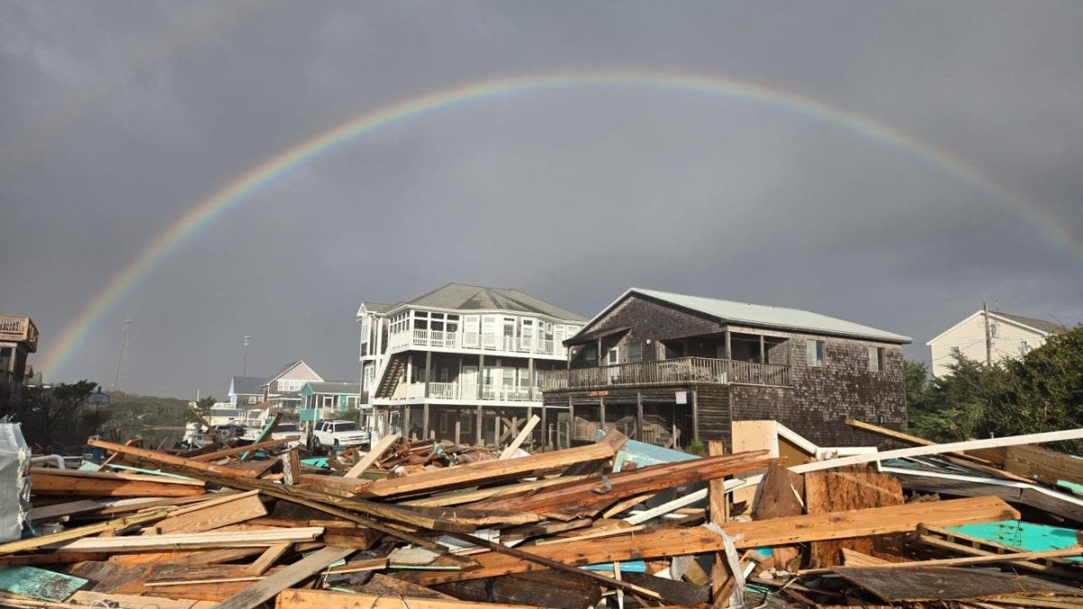 A rainbow appears Thursday morning over the debris in Buxton. Photo: Don Bowers/Island Free Press