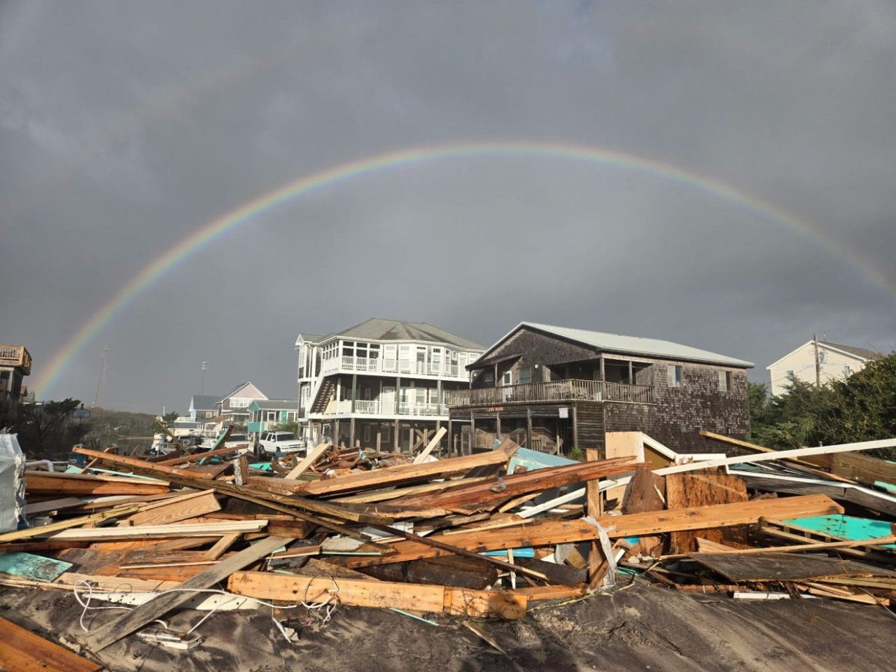 A rainbow appears Thursday morning over the debris in Buxton. Photo: Don Bowers/Island Free Press