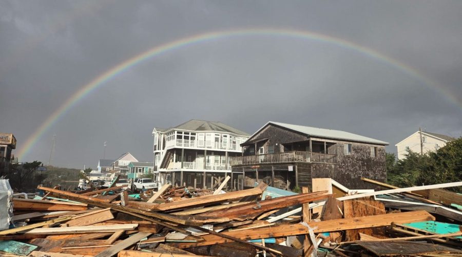 A rainbow appears Thursday morning over the debris in Buxton. Photo: Don Bowers/Island Free Press