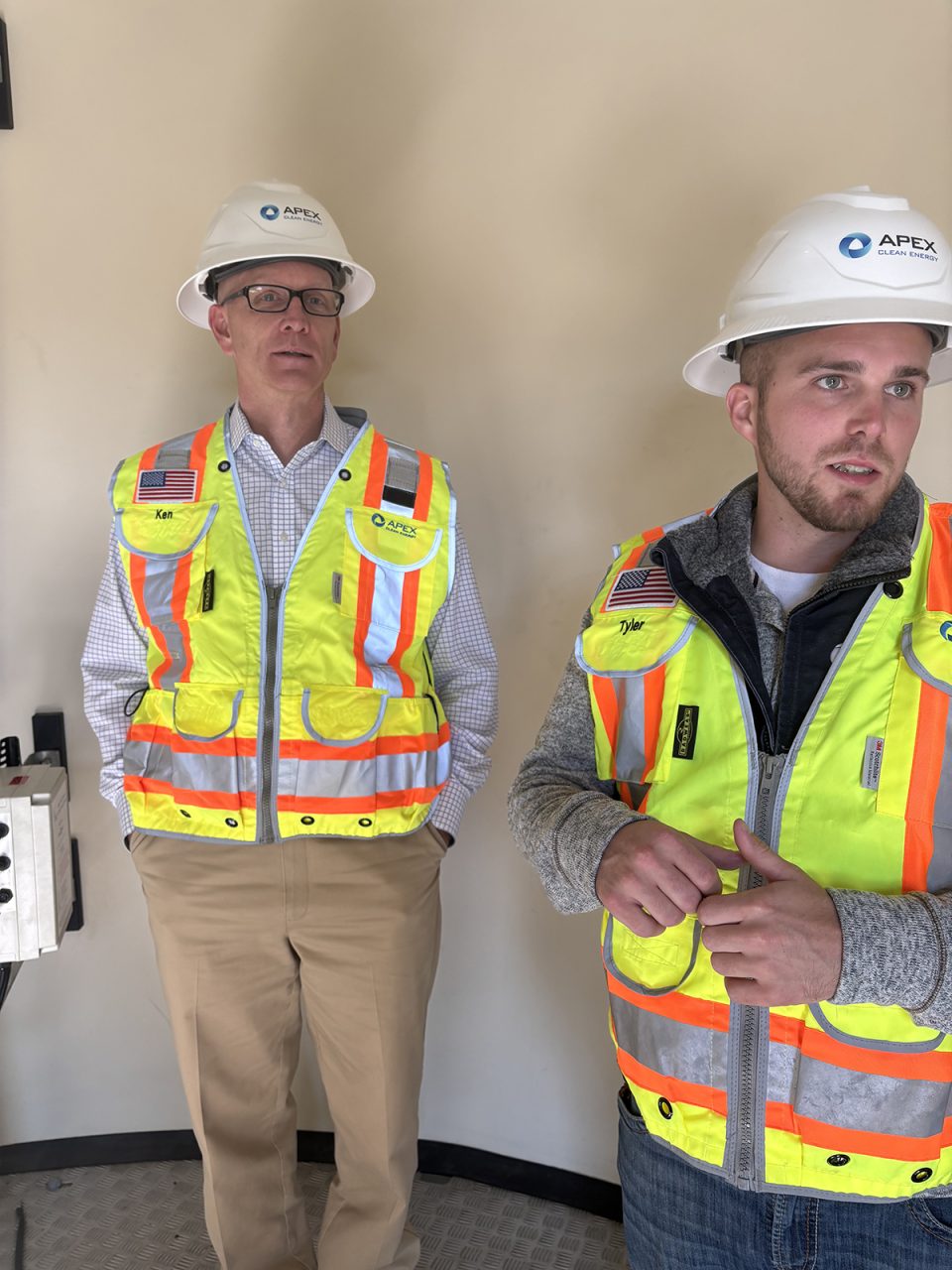 Ken Young, CEO of Apex Clean Energy, the operator of Timbermill Wind, and Tyler Finley, facility manager for Timbermill Wind, speak about the project while inside one of the turbine towers. Photo: Catherine Kozak