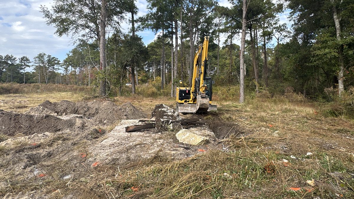 A contractor working for the Multistate Trust operates an excavator Nov. 7 to remove contaminated debris from the former treated and untreated wood storage area at the Kerr-McGee Navassa Superfund Site. The additional cleanup of contaminated soil and debris in Operable Unit 2 got going Nov. 3. Photo: Multistate Trust