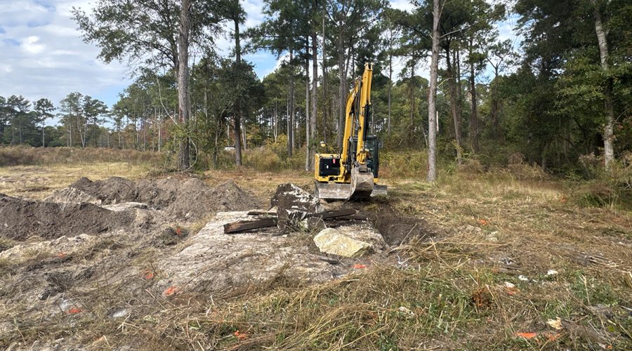 A contractor working for the Multistate Trust operates an excavator Nov. 7 to remove contaminated debris from the former treated and untreated wood storage area at the Kerr-McGee Navassa Superfund Site. The additional cleanup of contaminated soil and debris in Operable Unit 2 got going Nov. 3. Photo: Multistate Trust