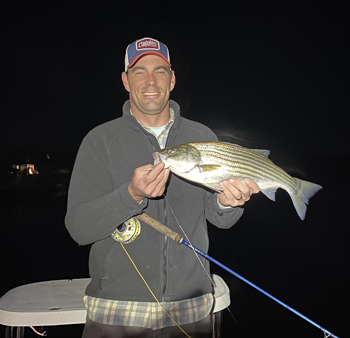 Quenten Lehrschall caught this big striped bass near a lighted dock in Beaufort. Photo: Gordon Churchill