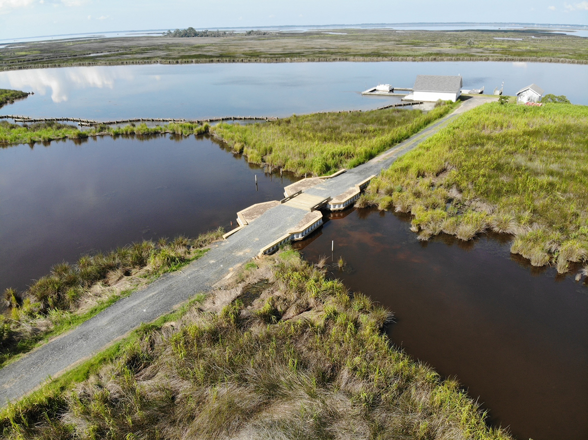 This aerial view of the bridge that replaced the causeway over the canal, which officials say allows greatly enhanced flow of water. Photo: Hunter Johnson