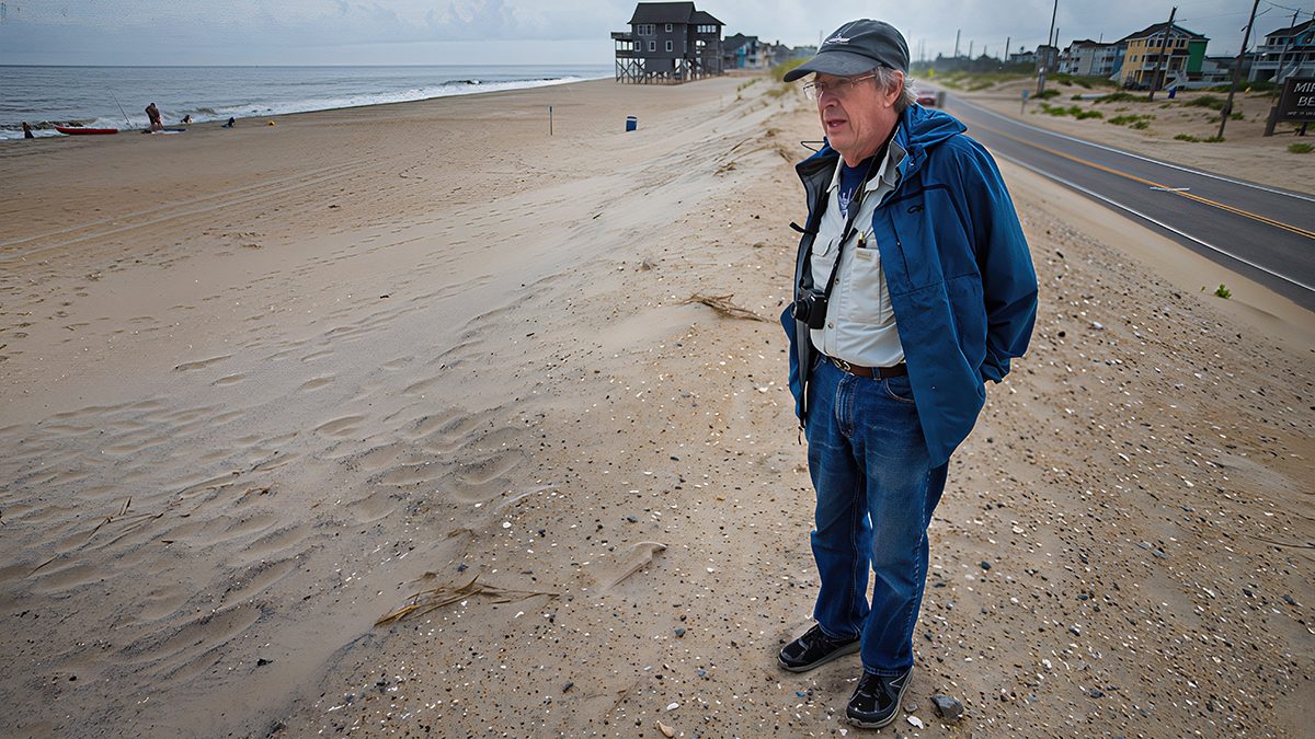 Dr. Stan Riggs takes in the view on Hatteras Island in July. Photo contributed.