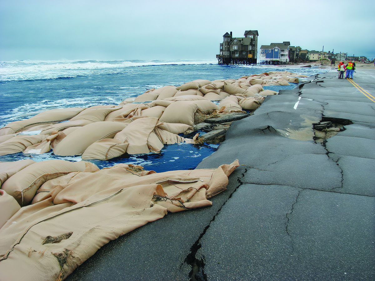 Sandbags do little to protect homes and infrastructure on Hatteras Island. Photo: NCDOT
