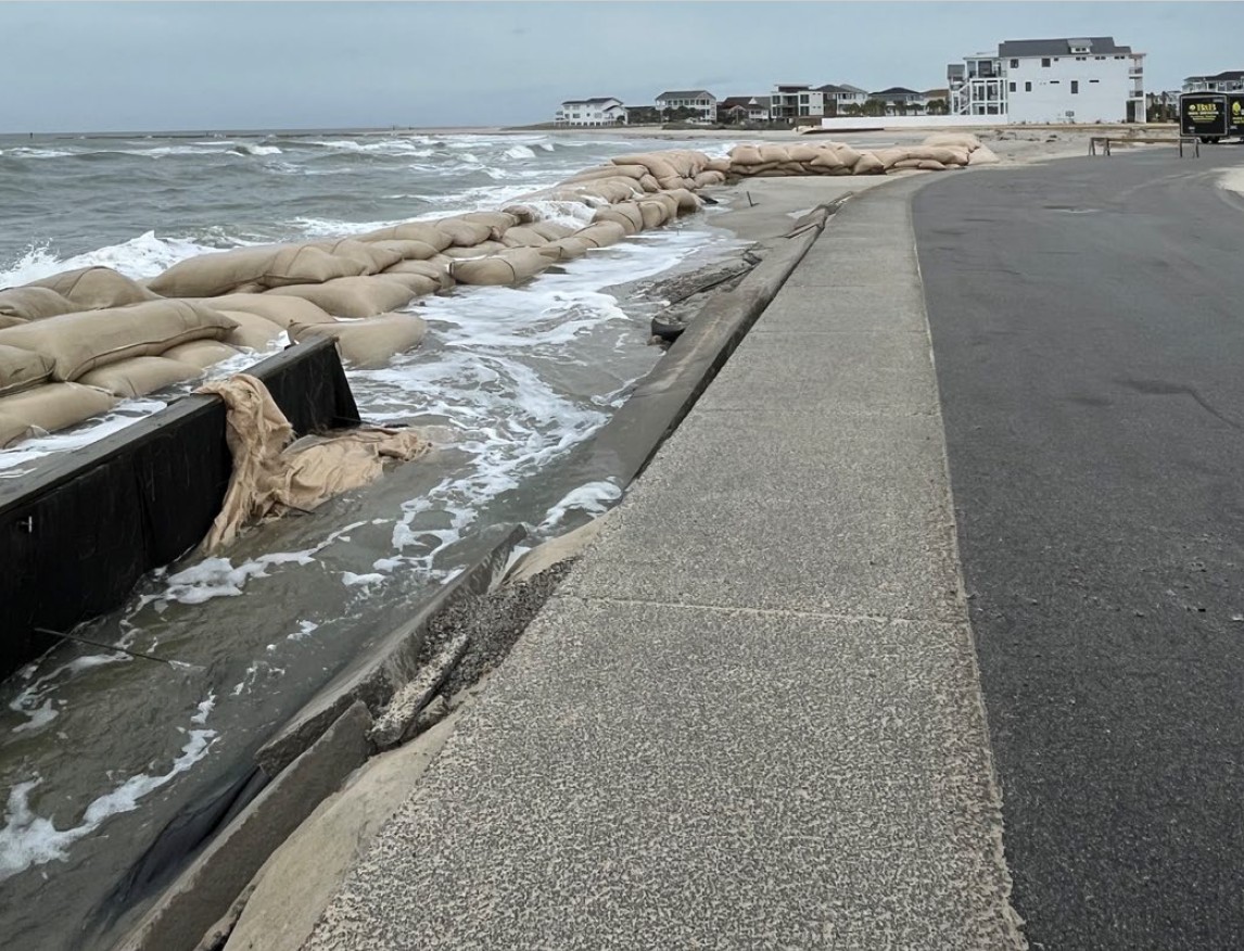 Sandbags line the roadway through The Pointe at Ocean Isle Beach. Photo: NCDEQ