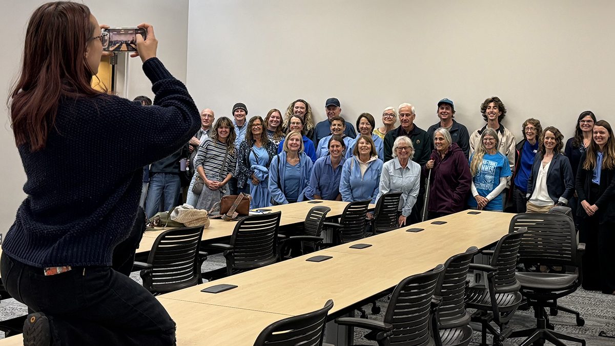 Those in attendance at the Division of Coastal Management hearing on the Wilmington Harbor project, many wearing blue in a show of solidarity, pose for a group photo. Photo: Trista Talton