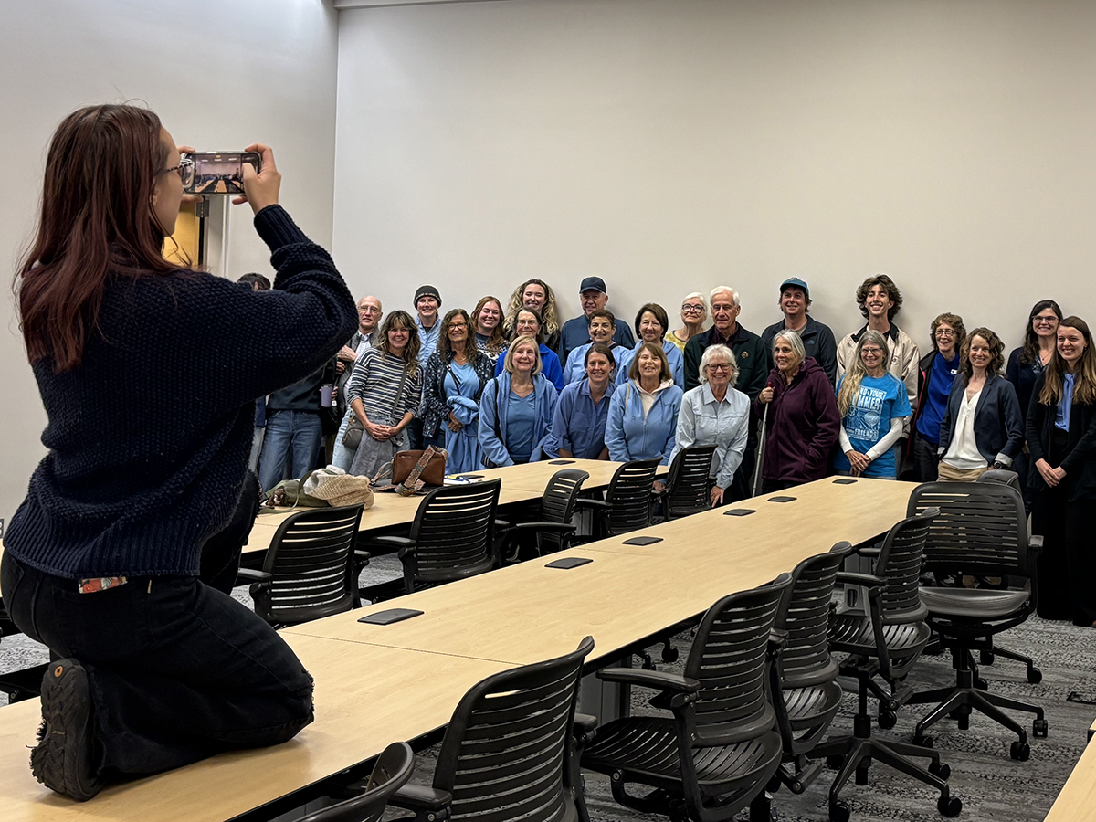 Those in attendance at the Division of Coastal Management hearing on the Wilmington Harbor project, many wearing blue in a show of solidarity, pose for a group photo. Photo: Trista Talton