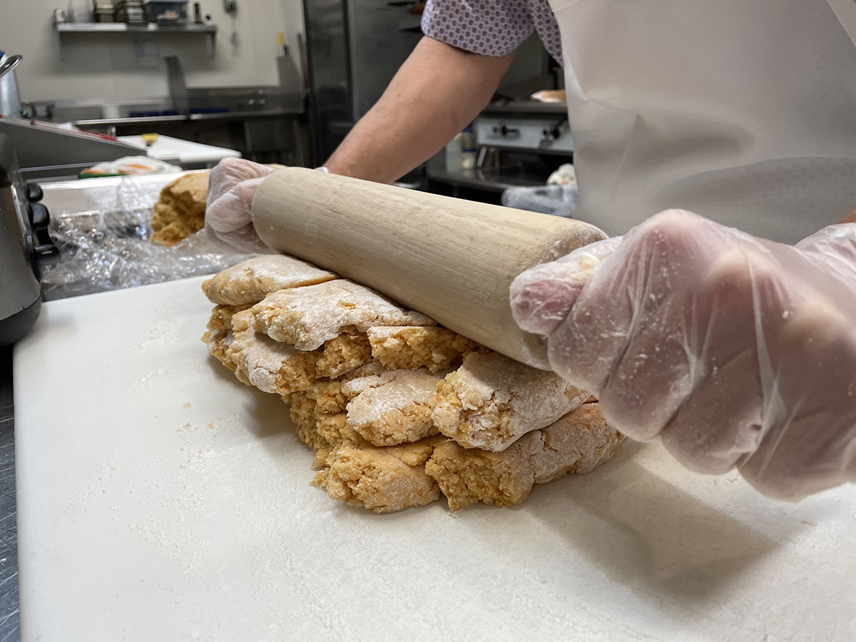 Folding sweet potato dough and rolling the layers helps ensure flaky biscuits at Taylor’s Oak Restaurant in Camden. Photo: Liz Biro