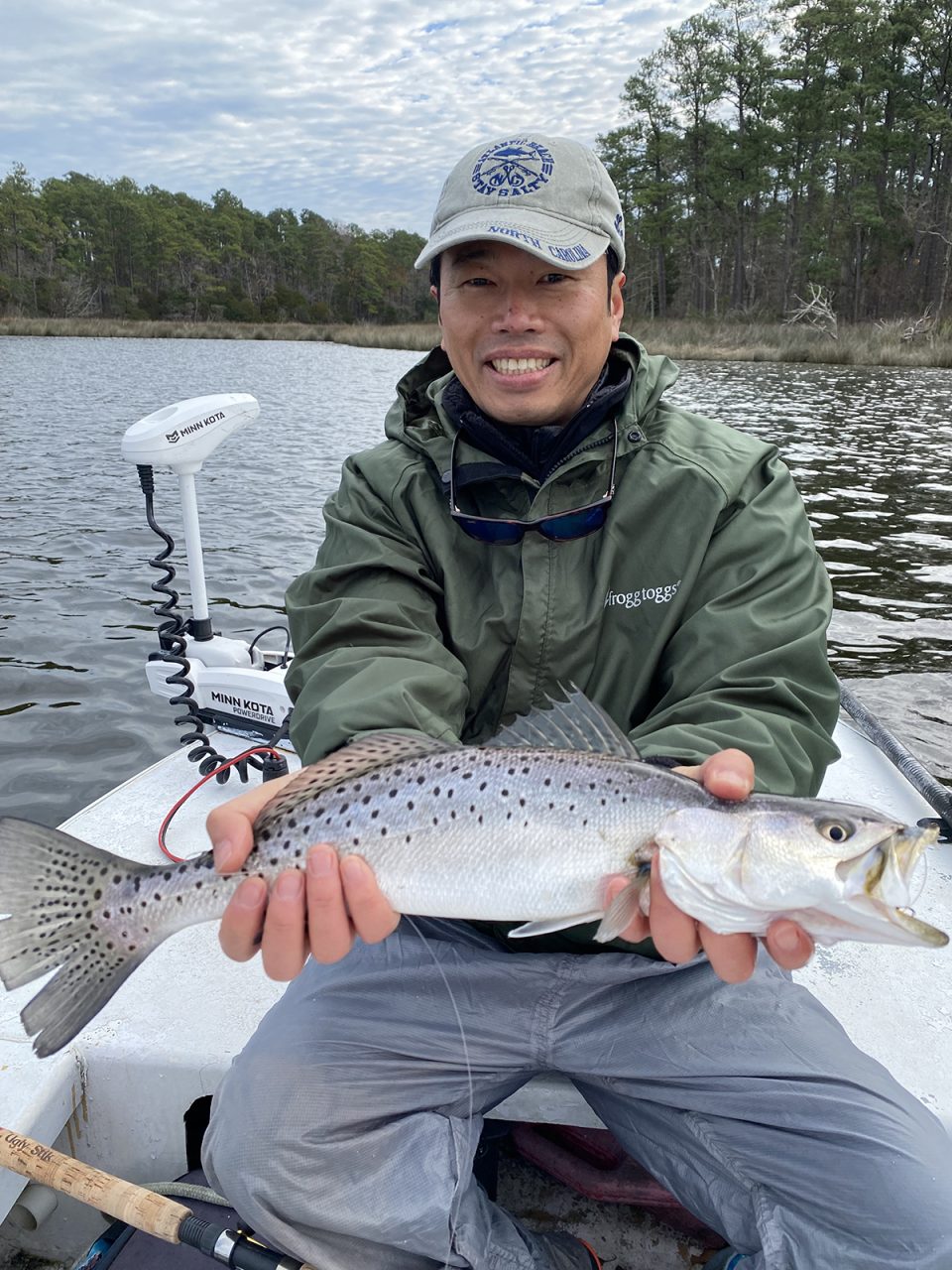 Shintaro Bunya of Cary shows off a trout from a big school that made a secret appearance, Photo: Gordon Churchill