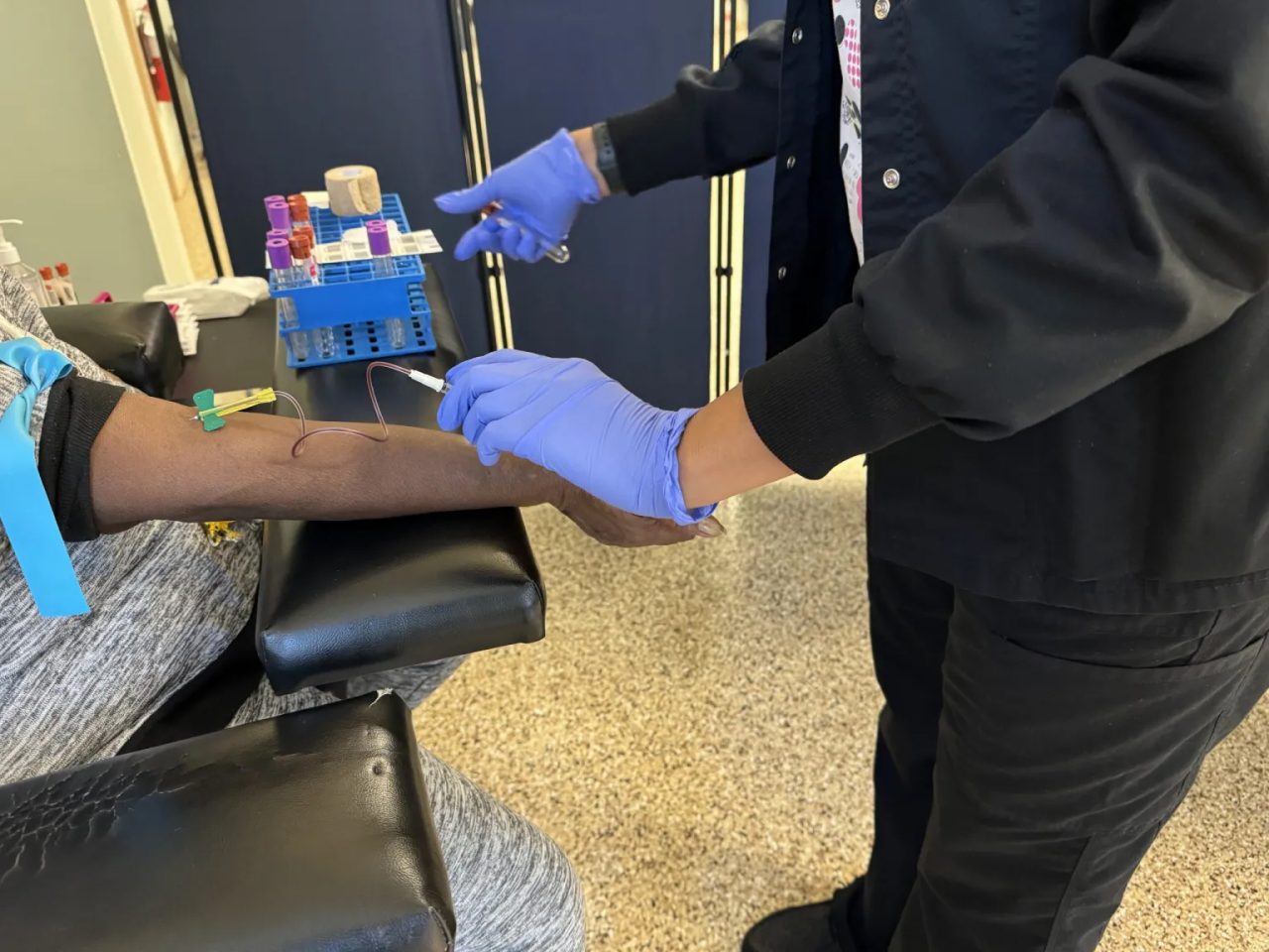 Phlebotomist Patricia Branham draws blood from a GenX Exposure Study participant at the Town of Navassa’s Community Center on Nov. 19, 2023.
