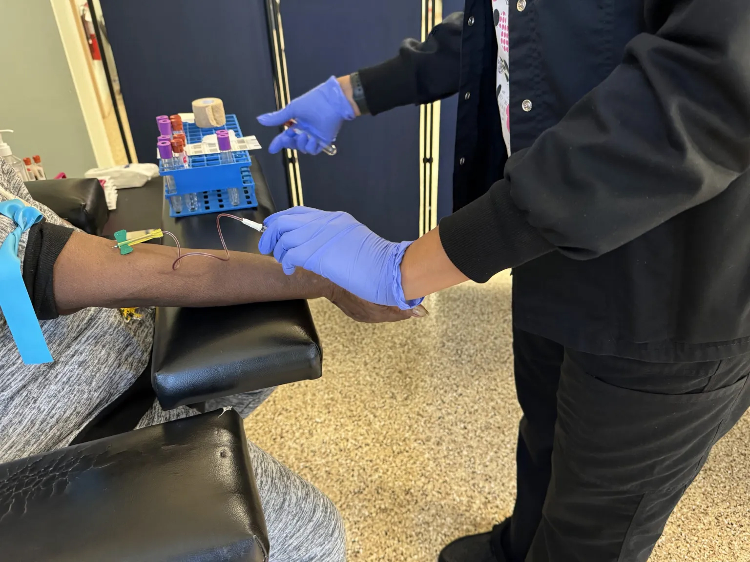 Phlebotomist Patricia Branham draws blood from a GenX Exposure Study participant at the Town of Navassa’s Community Center on Nov. 19, 2023.