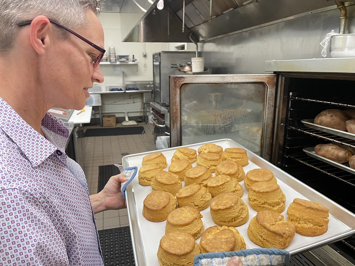 Katherine “Kat” Silverwood checks sweet potato biscuits at Taylor’s Oak Restaurant in Camden. Photo: Liz Biro