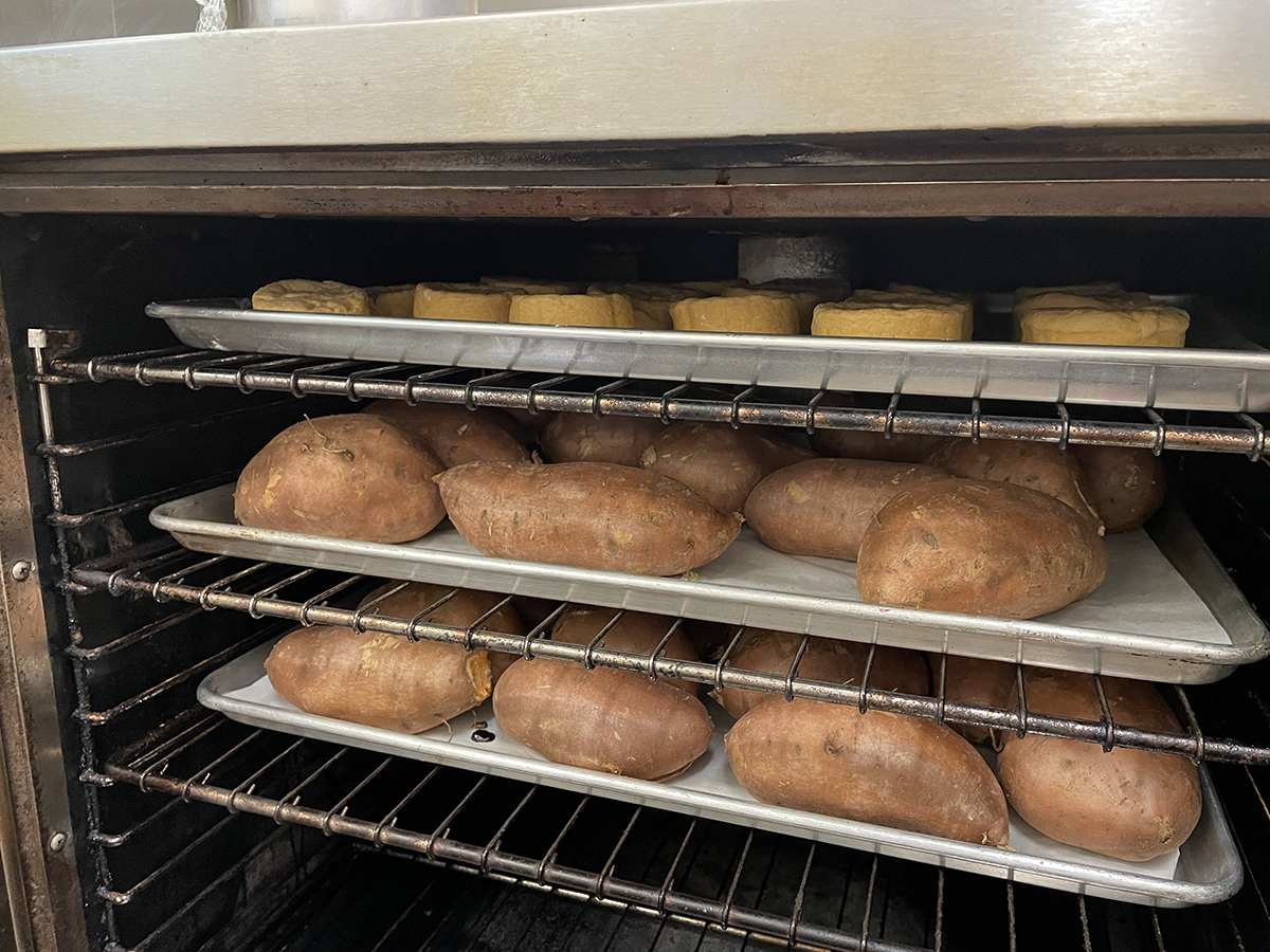 Sweet potatoes and sweet potato biscuits bake together in the oven at Taylor’s Oak Restaurant in Camden. Photo: Liz Biro