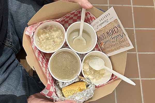 Ticketholder carries a try of four samples during a past Core Sound Chow Down. Photo: Core Sound