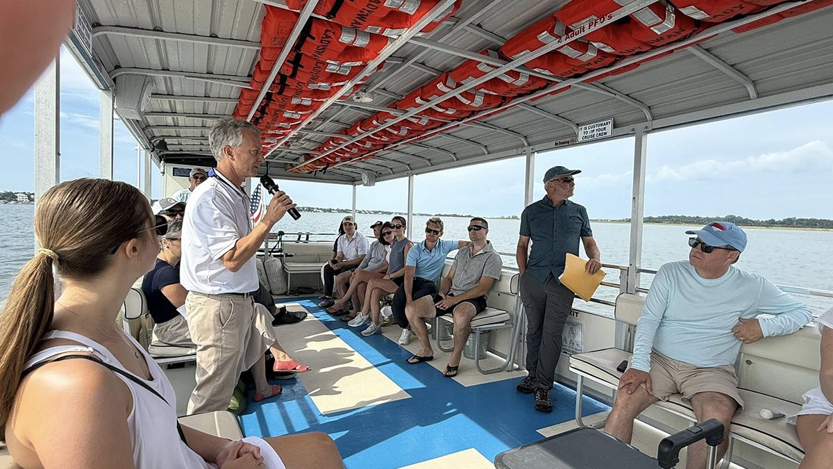 North Carolina Coastal Federation Executive Director Braxton Davis speaks to a group aboard a vessel in 2025. Photo: North Carolina Coastal Federation