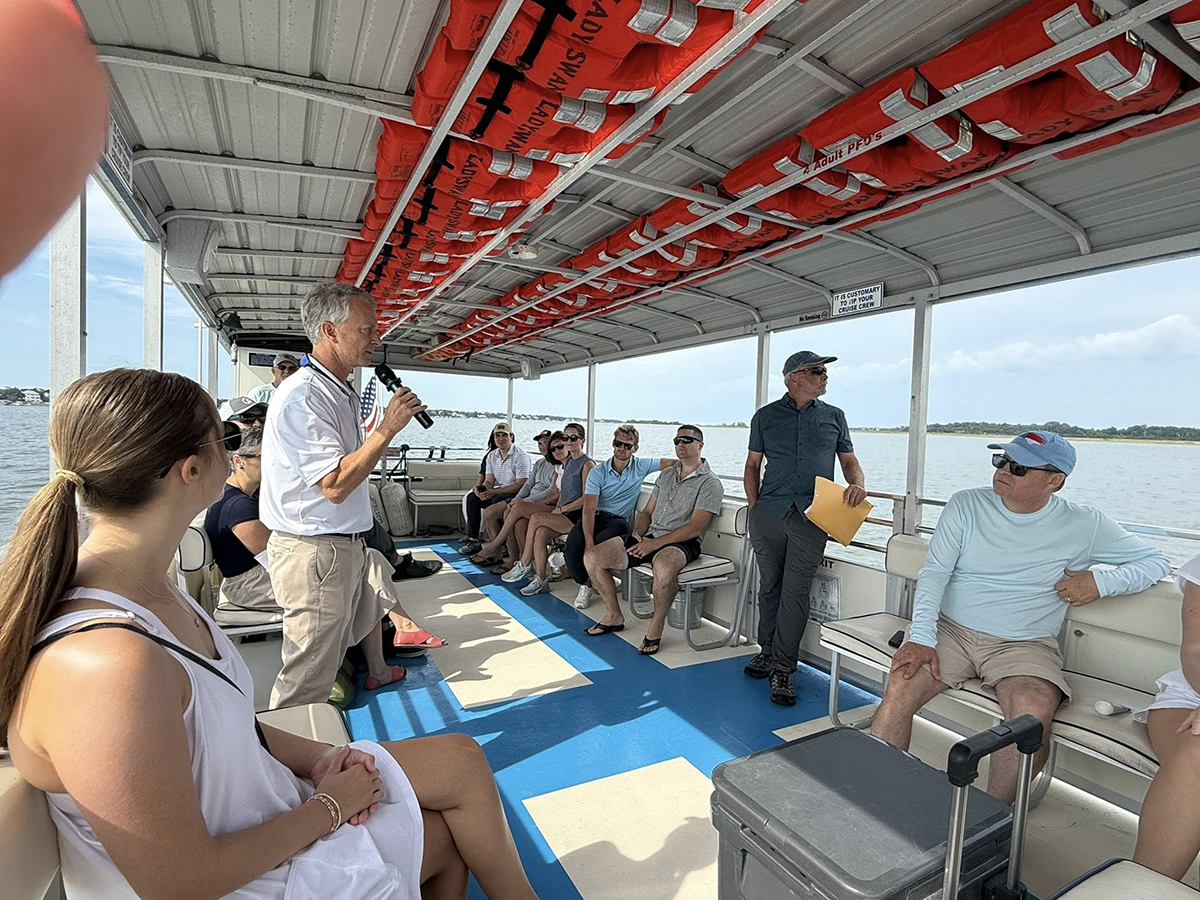 North Carolina Coastal Federation Executive Director Braxton Davis speaks to a group aboard a vessel in 2025. Photo: North Carolina Coastal Federation
