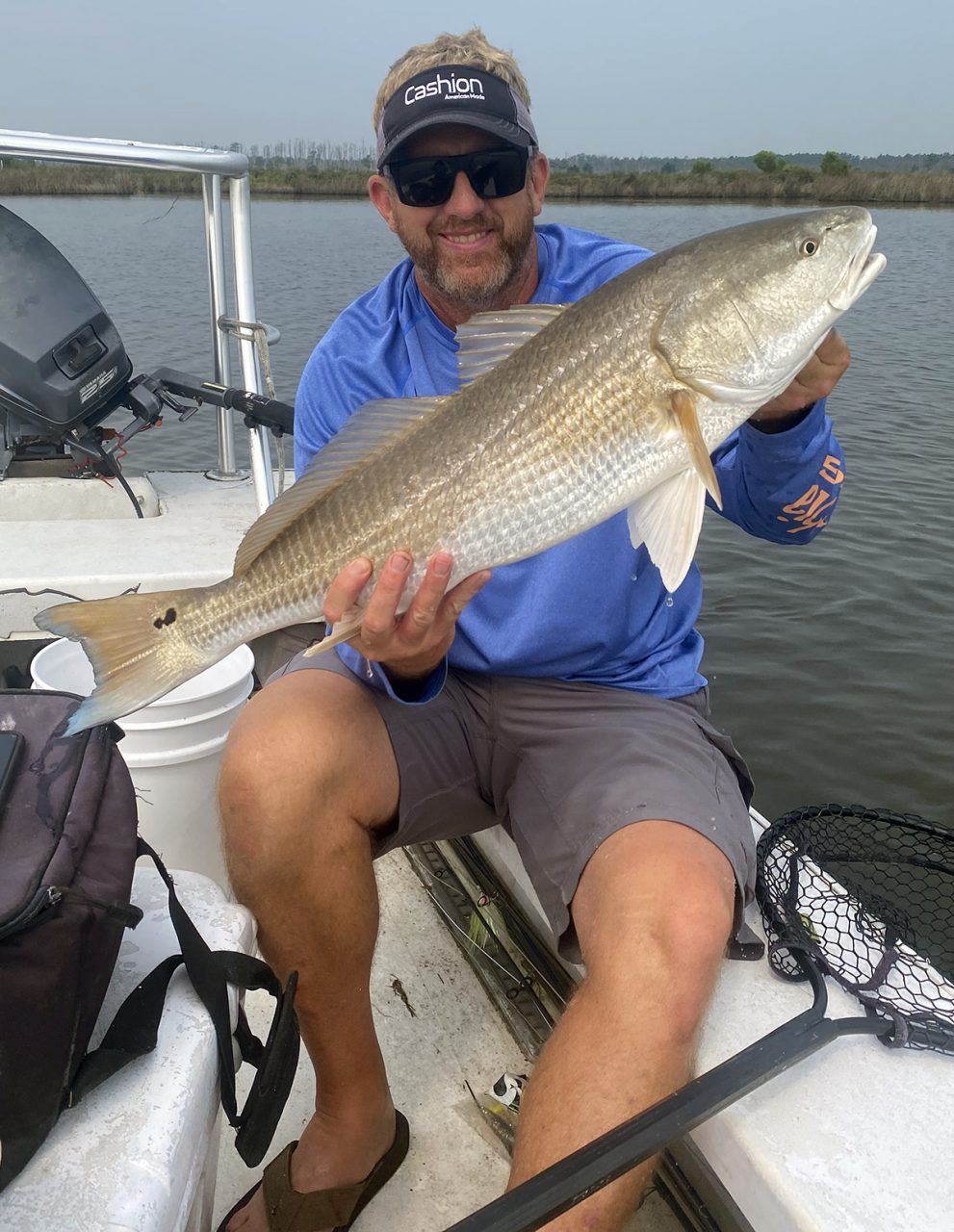 Capt. Rick Patterson shows off a redfish that couldn’t resist a plastic shrimp under a popping cork. Photo: Gordon Churchill
