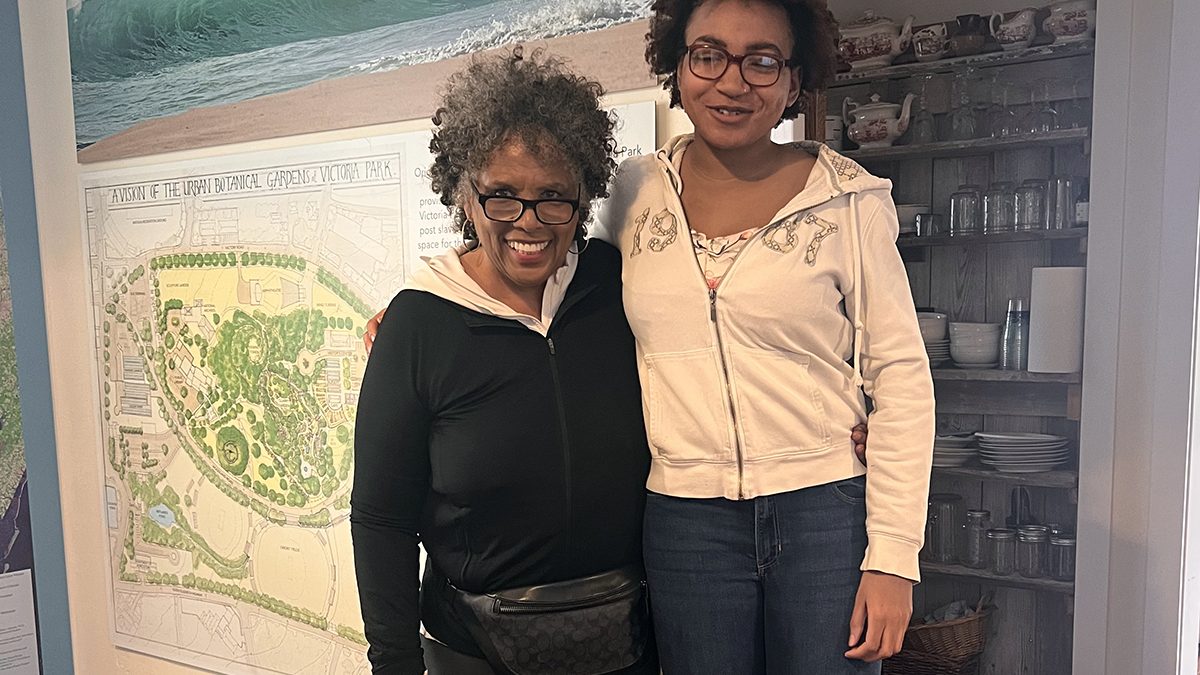 Joan Collins, left, is greeted by Kiara Brummell during Collins' first visit to The Water’s Edge in March 2025. Photo: Courtesy of Joan Collins