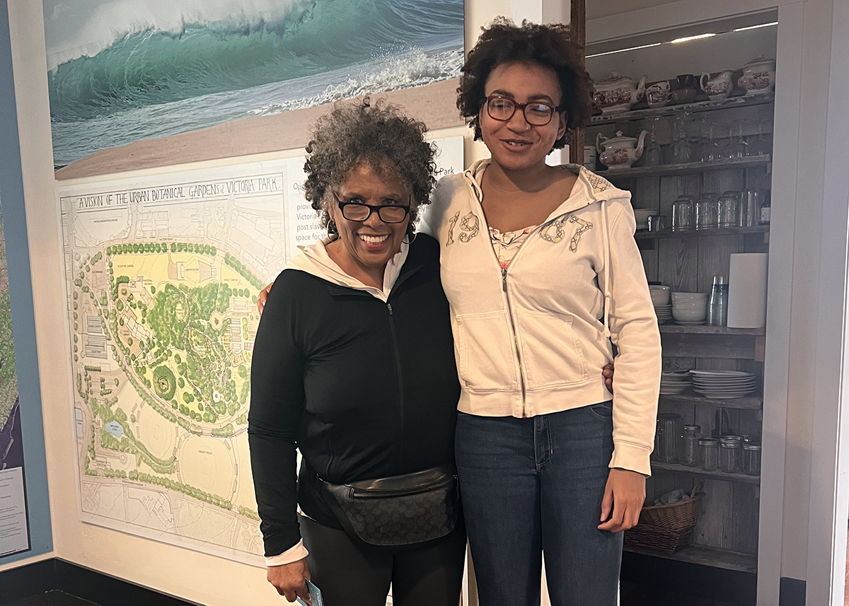 Joan Collins, left, is greeted by Kiara Brummell during Collins' first visit to The Water’s Edge in March 2025. Photo: Courtesy of Joan Collins