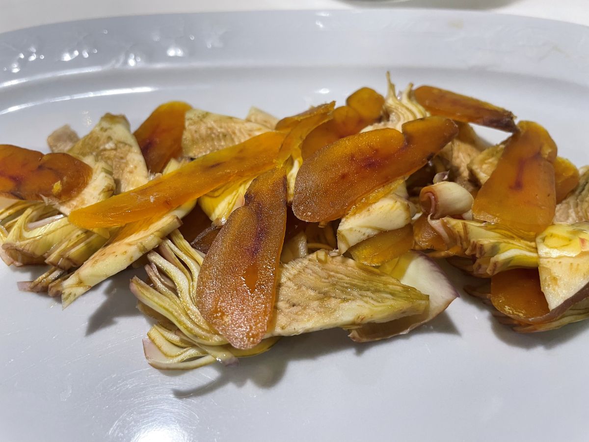 Sliced bottarga on purple artichokes in a restaurant in Cagliari, Sardinia. Photo: David Burney