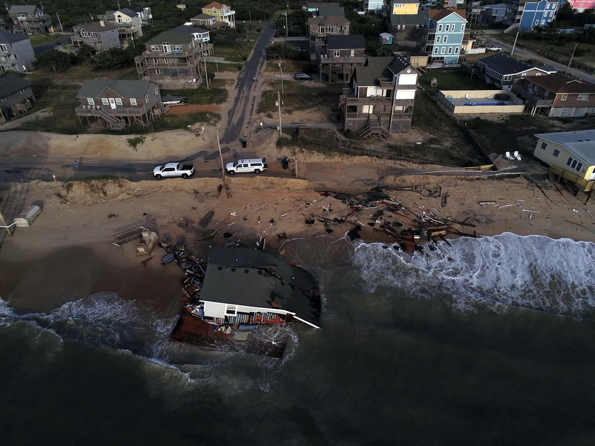 Waves spread debris associated with a house collapse at 24131 Ocean Drive in Rodanthe in May 2024. Photo: National Park Service