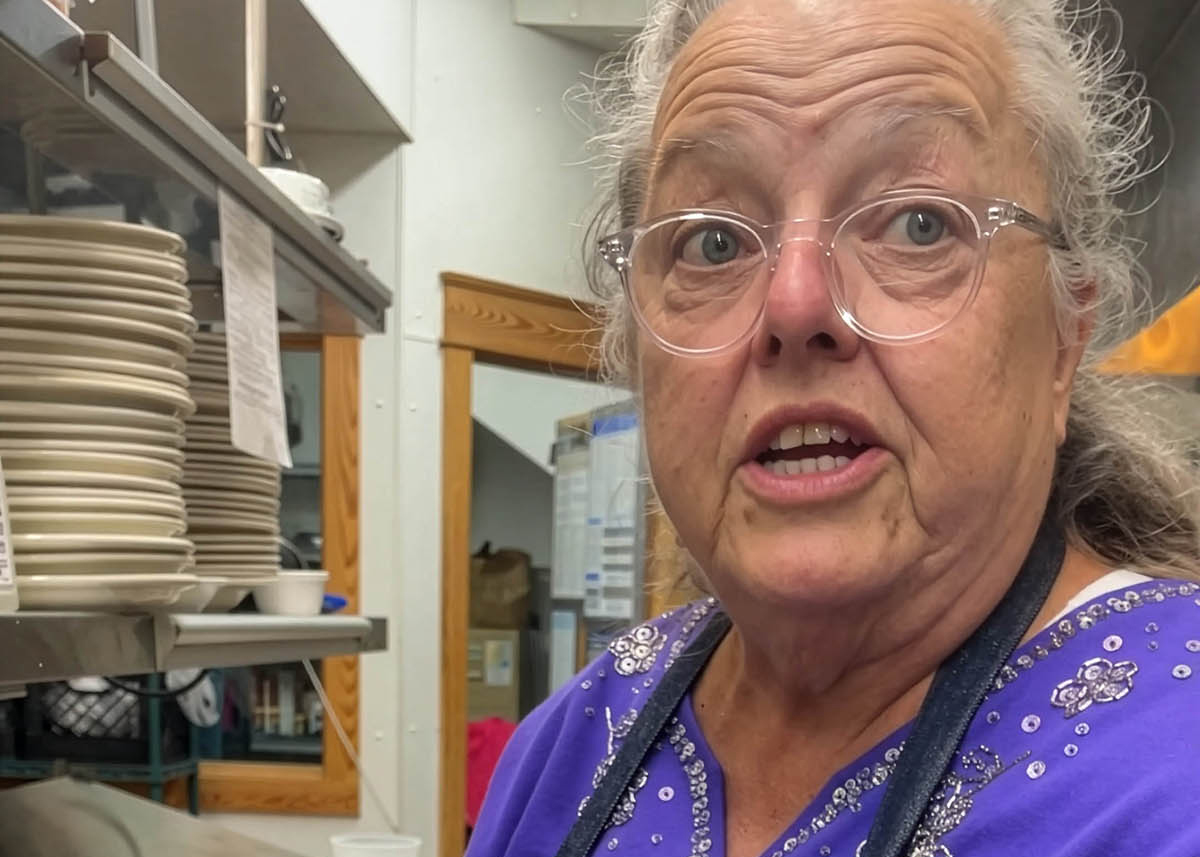 “This is a very traditional food on these banks,” Sharon Peele Kennedy says as she shapes Outer Banks fish cakes during a March 2023 fundraiser for NC Catch at Basnight’s Lone Cedar Café in Nags Head. Photo: Liz Biro