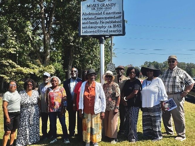 Congressman Don Davis, fifth from left, join others at the September 2025 unveiling of the Moses Grandy historical highway marker.