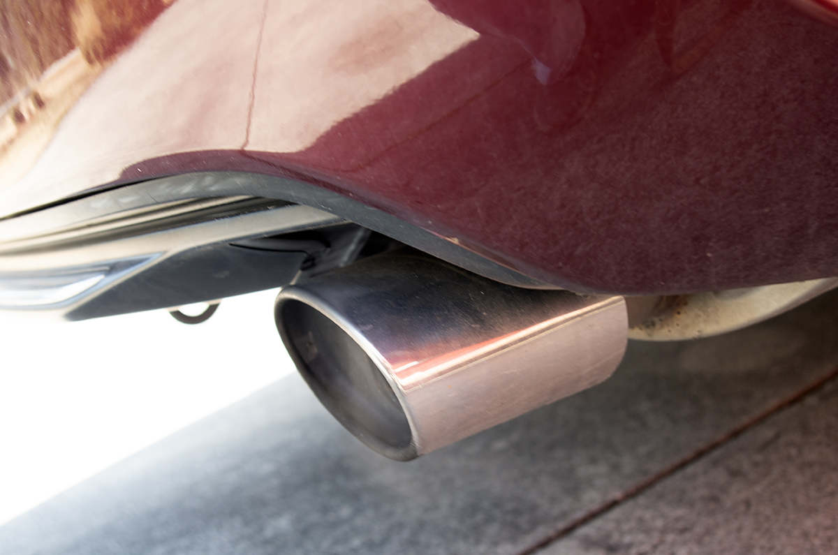 A gasoline-powered car emits exhaust . Photo: Mark Hibbs