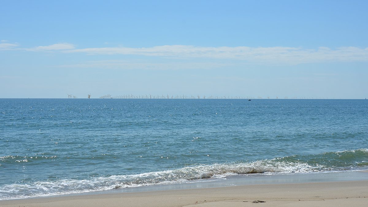 This image from a visualization study commissioned by the Southeast Wind Coalition in 2022 for the Carolina Long Bay offshore wind project that is now scuttled shows how the turbines would appear from the beach at Bald Head Island.