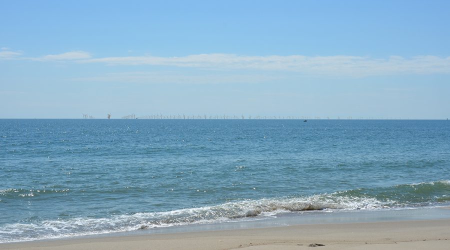 This image from a visualization study commissioned by the Southeast Wind Coalition in 2022 for the Carolina Long Bay offshore wind project that is now scuttled shows how the turbines would appear from the beach at Bald Head Island.