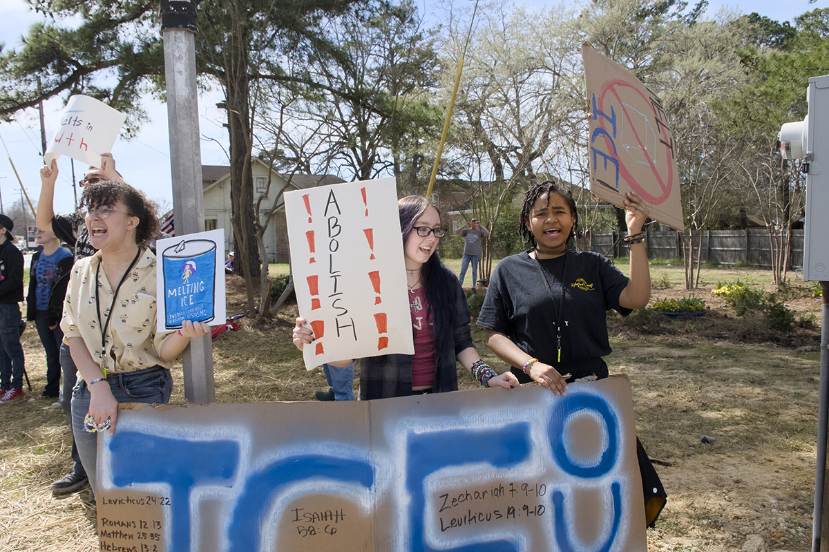 High school students, from left, Bird Lashbrook, Ranier Bradshaw and Zinc Mabine, take part in the protest Saturday in Ahoskie. Photo: Kip Tabb